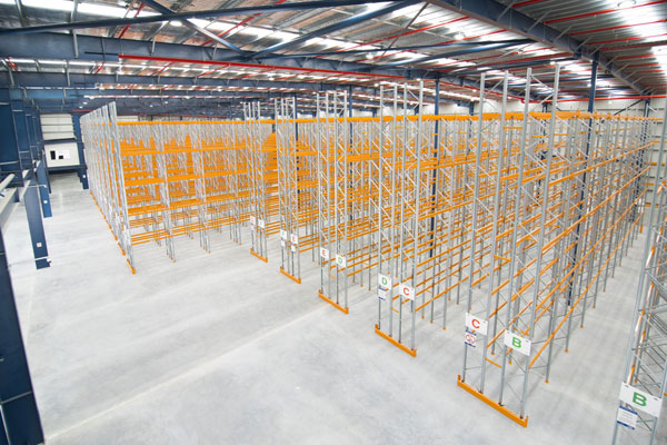 The empty racks in our warehouse before we stocked them full of magnets, keyrings, wind chimes and souvenirs